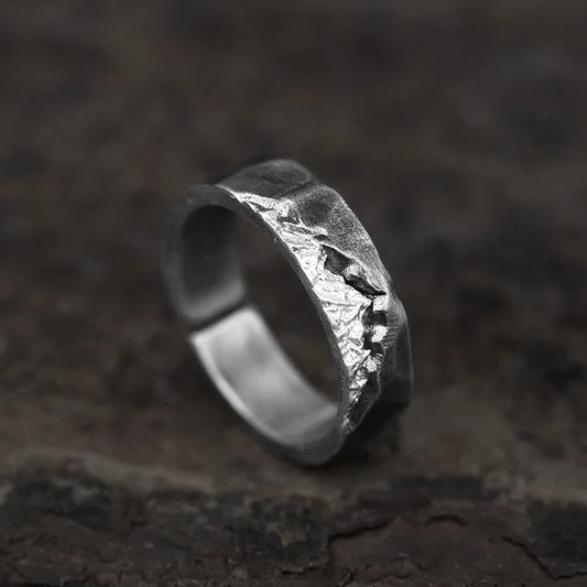 Alpine Ridge Hand-Carved Silver Ring on Weathered Wood