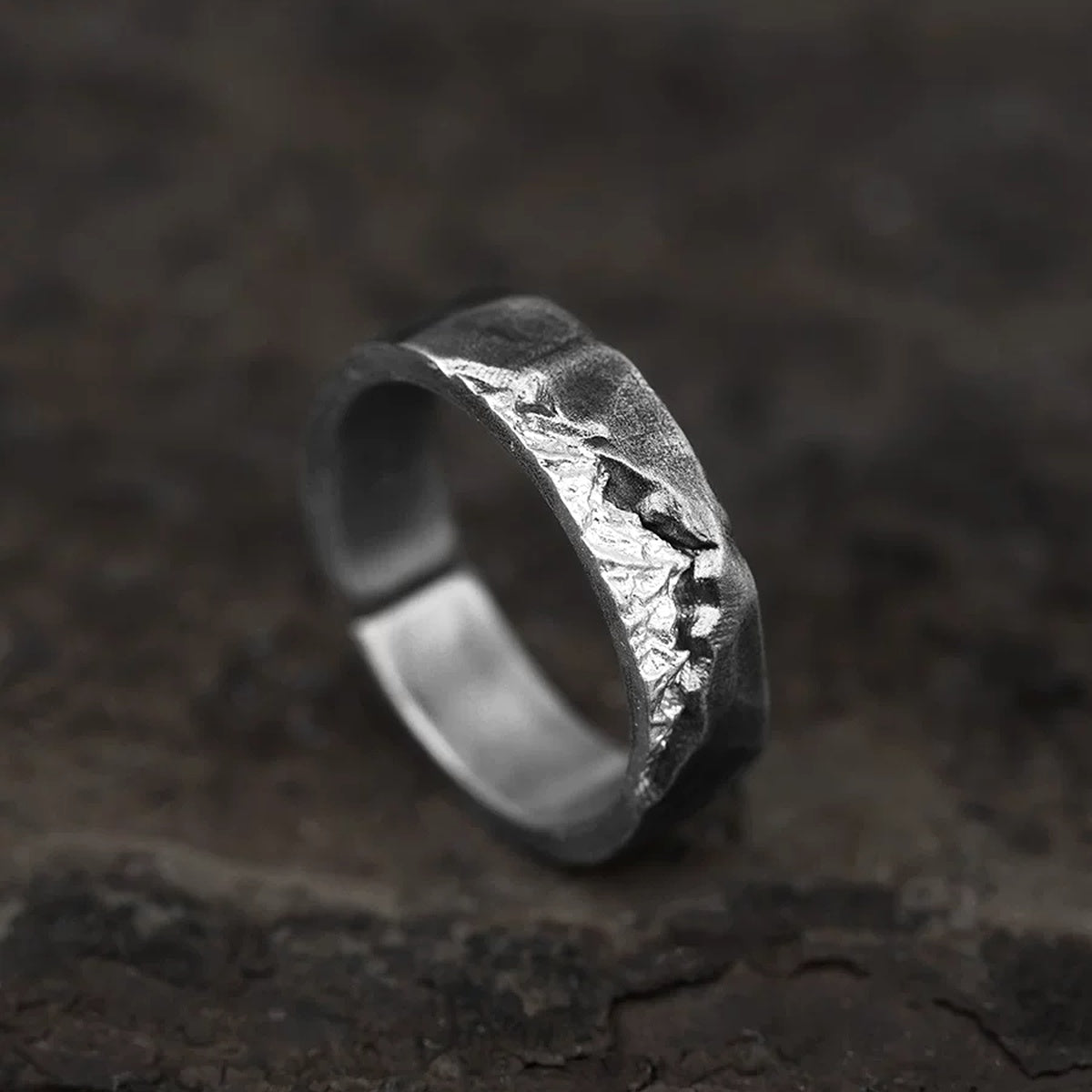 Alpine Ridge Hand-Carved Silver Ring on Weathered Wood